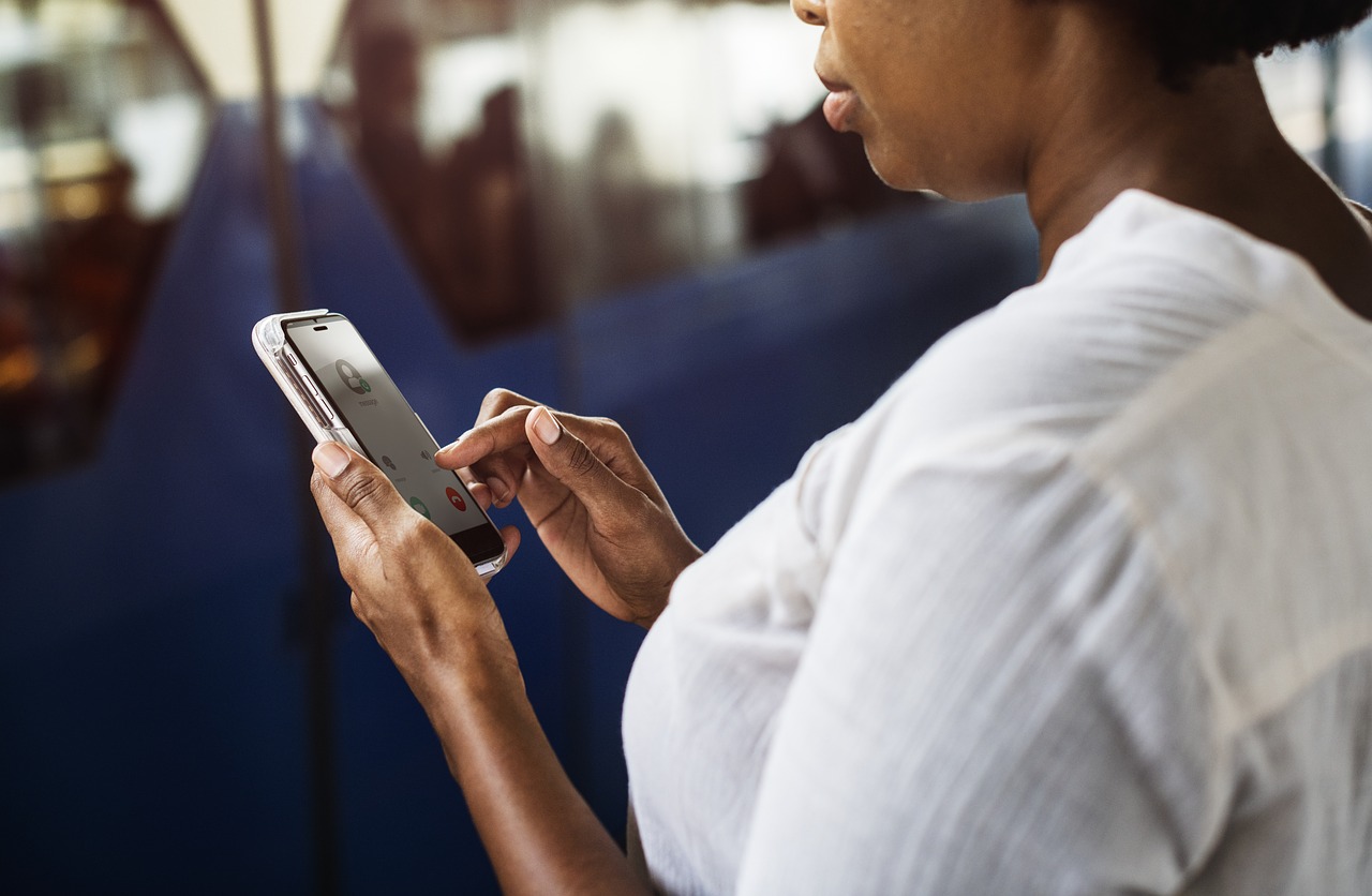 Image of woman looking at smartphone