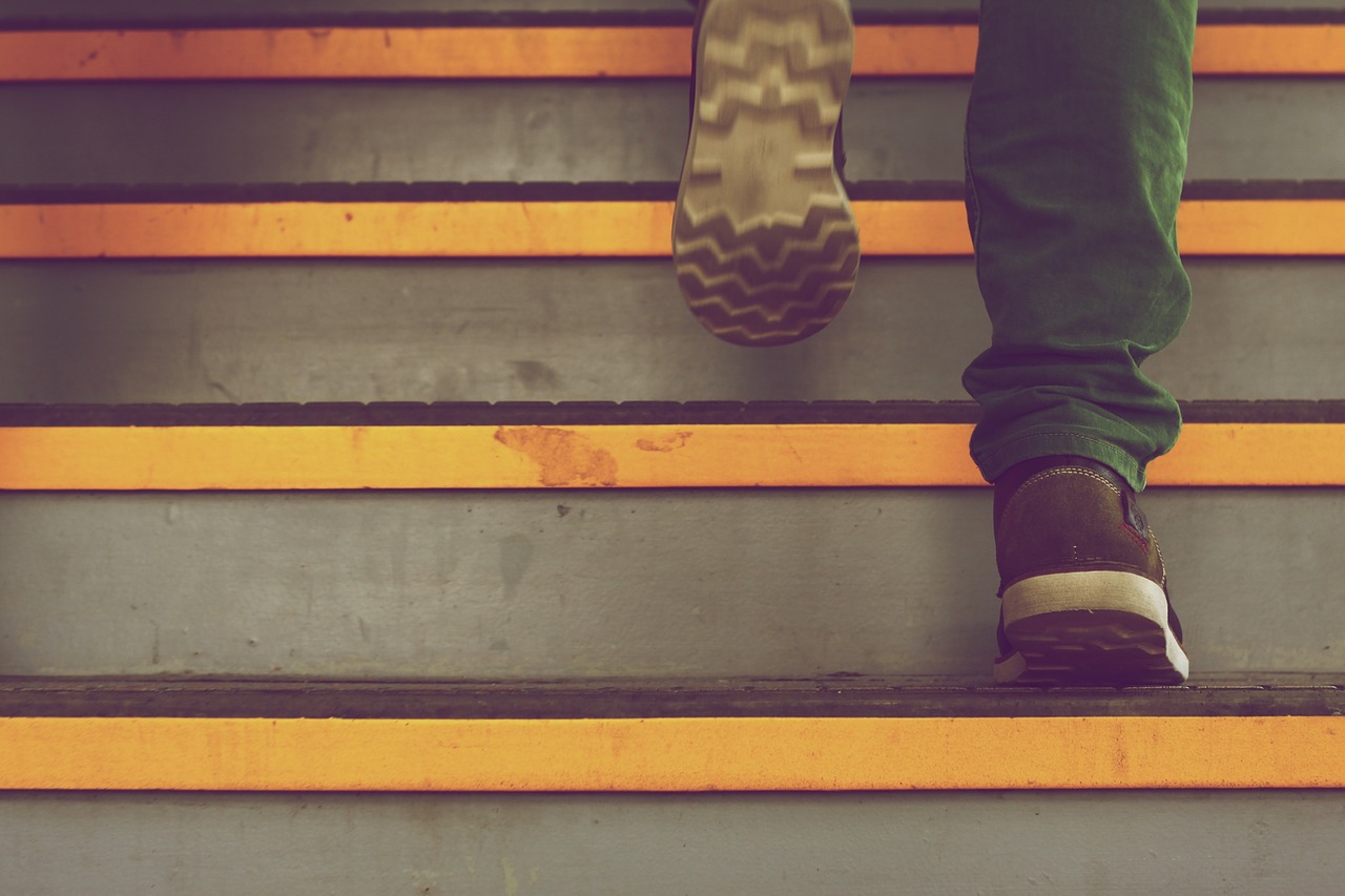 Closeup shot of someone walking up stairs.