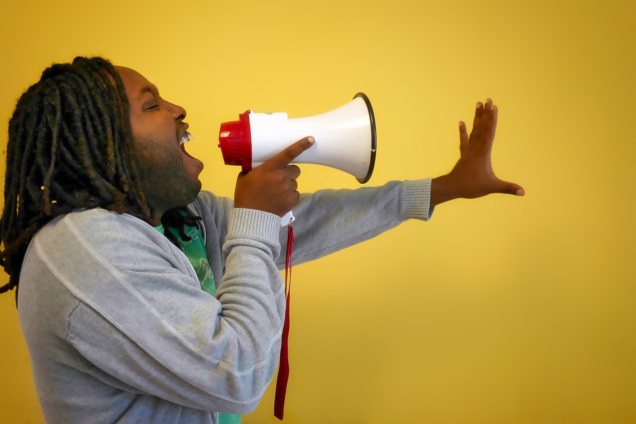 Image of man shouting into megaphone